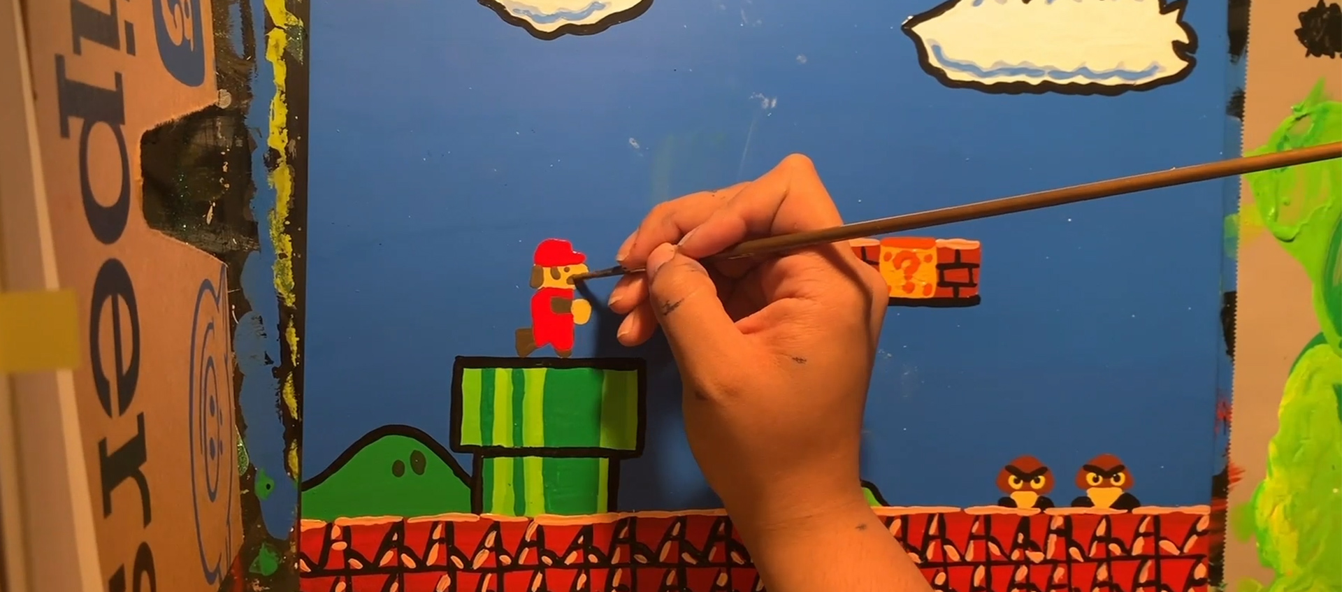 Artist Bethani Blake paints a miniature environment inspired by Original Mario Bros videogame